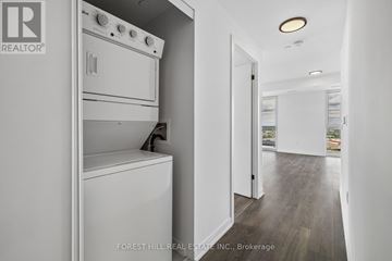 Burlington (Alton) condo for rent - A white oven and dishwasher in a modern kitchen.
