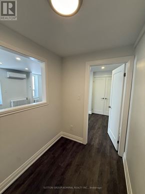 Toronto (Forest Hill South) house for rent - A hallway with wood floors and white walls.