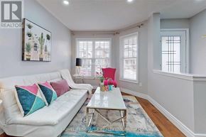 Brampton (Fletcher's Meadow) apartment for rent - A living room with a white couch and a glass coffee table.
