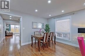 Brampton (Fletcher's Meadow) apartment for rent - A dining room with a wooden table and chairs.