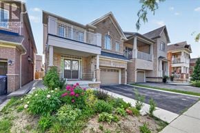 Brampton (Credit Valley) apartment for rent - A row of houses with a well-maintained front yard.
