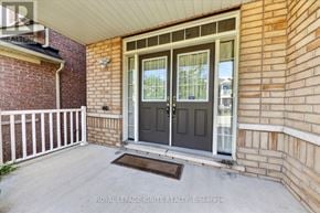 Brampton (Credit Valley) apartment for rent - A house entrance with a grey door and a white railing.