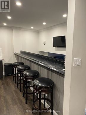 Aurora (Aurora Village) townhouse for rent - A bar area with stools and a television mounted on the wall.