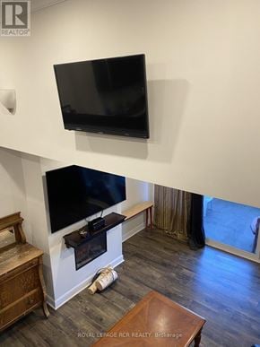 Aurora (Aurora Village) townhouse for rent - A black TV mounted on a white wall above a fireplace.