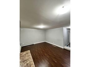 Surrey apartment for rent - A room with a brown rug on the floor.