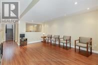 Brampton (Snelgrove) apartment for rent - A living room with a row of chairs and a logo that says REALTOR.