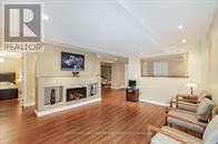 Brampton (Snelgrove) apartment for rent - A living room with a fireplace and a couch.