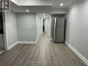 Milton (Wi Willmott) townhouse for rent - A spacious kitchen with a refrigerator on the right side.