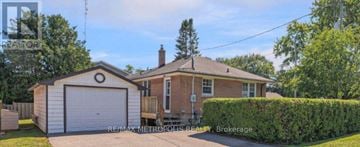 Whitby (Downtown Whitby) apartment for rent - A house with a white garage door is for sale.