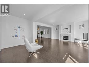 Coquitlam apartment for rent - A white chair is in a large empty room with a fireplace.