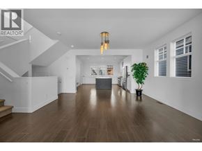 Coquitlam apartment for rent - A realtor logo is on the top left of a photo of a modern living room.