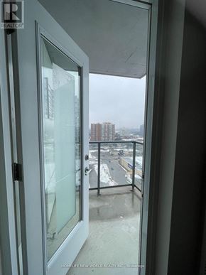 Toronto (Tam O'shanter-Sullivan) condo for rent - A view from a window of a cityscape from a room with a glass door.