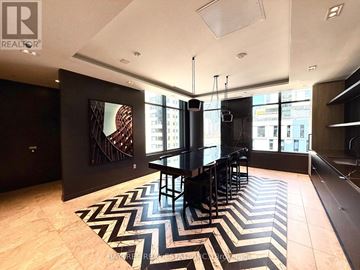 Toronto (Church-Yonge Corridor) condo for rent - A black and white chevron rug is on the floor of this modern living room.