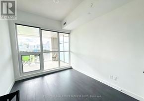 Toronto (Bayview Village) condo for rent - A room with a sliding glass door leading to a balcony.