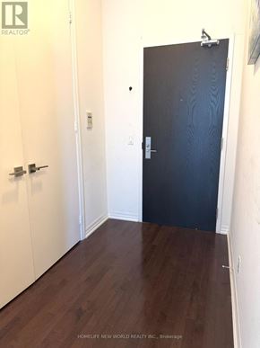 Toronto (Church-Yonge Corridor) condo for rent - A black door is in a white hallway.