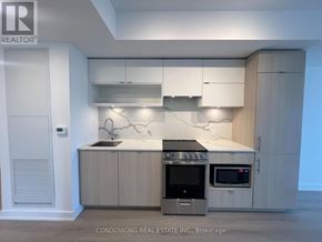 Toronto (Church-Yonge Corridor) condo for rent - A modern kitchen with a stainless steel oven and microwave.