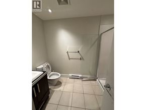 Vancouver apartment for rent - A bathroom with a toilet, sink, and shower.