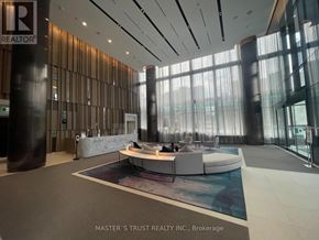Toronto (North St. James Town) condo for rent - A reception area with a large table and chairs.