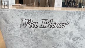 Toronto (North St. James Town) condo for rent - A sign that says "Via Bloor" is displayed on a marble-like surface.