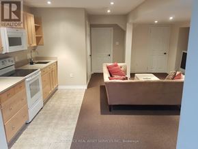 Toronto (Ionview) duplex for rent - A kitchen with a microwave, oven, and sink.