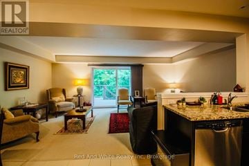 Cambridge townhouse for rent - A well-lit kitchen and living room with a dining table and chairs.