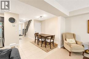 Cambridge townhouse for rent - A living room with a couch, chair, and dining table.