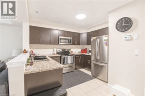 Cambridge townhouse for rent - A kitchen with a granite countertop and stainless steel appliances.