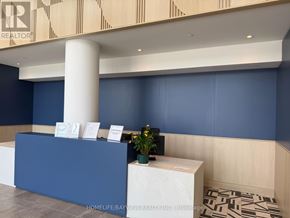 Burlington (Appleby) condo for rent - A reception area with a blue wall and a white pillar.