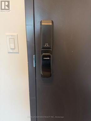 Burlington (Appleby) condo for rent - A modern electronic door lock with a keypad and keypad lock.