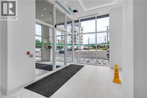Brantford condo for rent - A bright white interior with a black and white rug in front of a glass door.