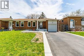 Brampton (Central Park) apartment for rent - A house with a well-maintained lawn and a clear sky above.
