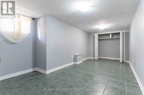 Brampton (Central Park) apartment for rent - A room with a grey floor and white walls.