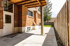 Brampton (Central Park) apartment for rent - A brick building with a white door and a covered walkway.
