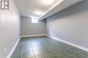 Brampton (Central Park) apartment for rent - A room with a tiled floor and a window on the wall.