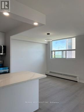 Mississauga (Cooksville) condo for rent - A spacious room with a large window and a white countertop.