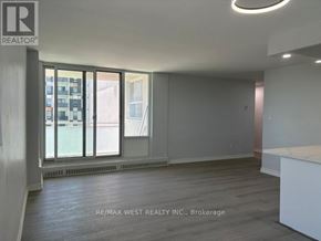 Mississauga (Cooksville) condo for rent - A room with a large window and a white counter.