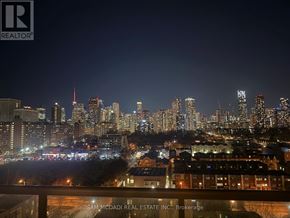 Toronto (Regent Park) condo for rent - A cityscape at night with the text "SAM MCADAI REAL ESTATE INC., Brokerage" on the bottom.