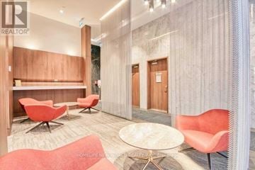 Toronto (Waterfront Communities) condo for rent - A living room with a sofa, chairs and a table.
