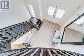 Oakville (Wt West Oak Trails) apartment for rent - A view from the top of a staircase looking down at a tiled floor.