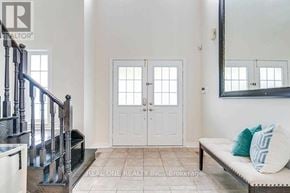 Oakville (Wt West Oak Trails) apartment for rent - A white double door with windows in between is seen in a room.
