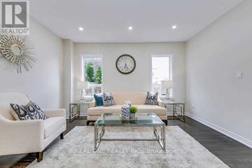 Oakville (Wt West Oak Trails) apartment for rent - A living room with a glass coffee table and a white sofa.