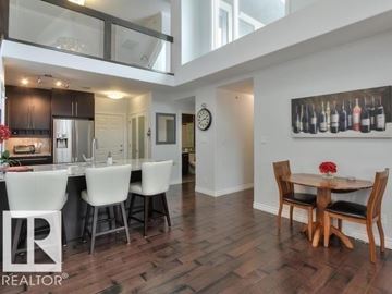 Edmonton apartment for rent - A modern kitchen with a dining table set for two.