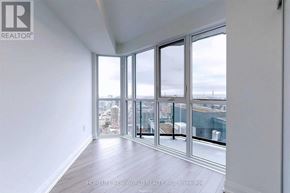 Toronto (Church-Yonge Corridor) condo for rent - A room with a view of the city through large windows.