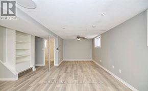 Welland (N. Welland) apartment for rent - A spacious room with wooden flooring and a ceiling fan.