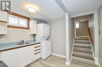 Welland (N. Welland) apartment for rent - A kitchen with white cabinets and a sink.