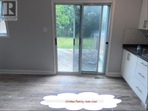 Brampton (Northgate) apartment for rent - A kitchen with a view of the backyard through the sliding glass doors.