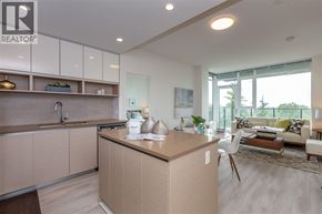 Burnaby apartment for rent - A modern kitchen with a wooden island and white cabinets.