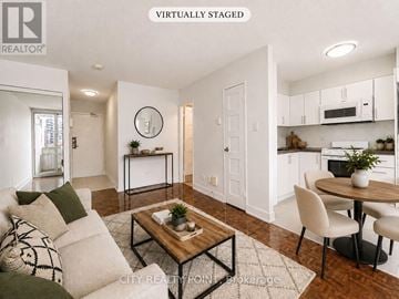 Toronto (Church-Yonge Corridor) condo for rent - A modern living room with a white couch and a coffee table.
