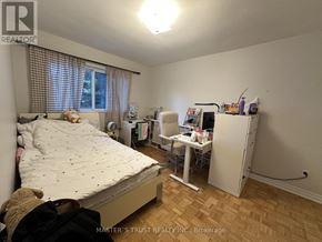 Toronto (Bayview Woods-Steeles) townhouse for rent - A bedroom with a bed, desk, and chair.