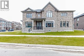 Cambridge apartment for rent - A large stone house with a black iron railing on the front porch.